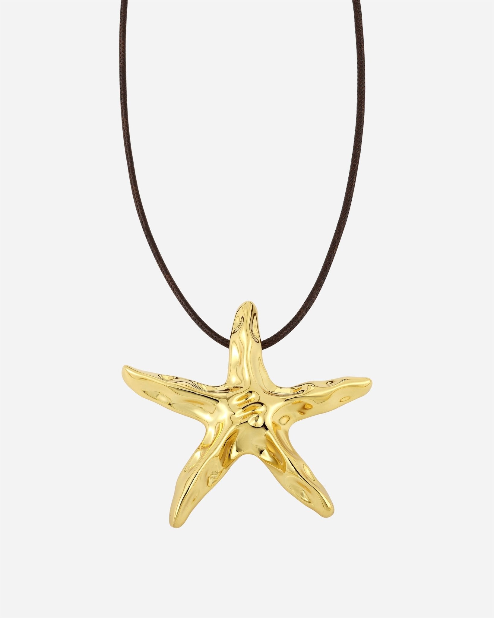 Estrella Halskette/Brosche – Nahaufnahme Stern-Detail aus vergoldetem Metall, Cosytas